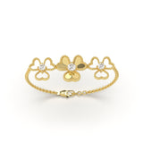 Gold chain bracelet with floral heart design