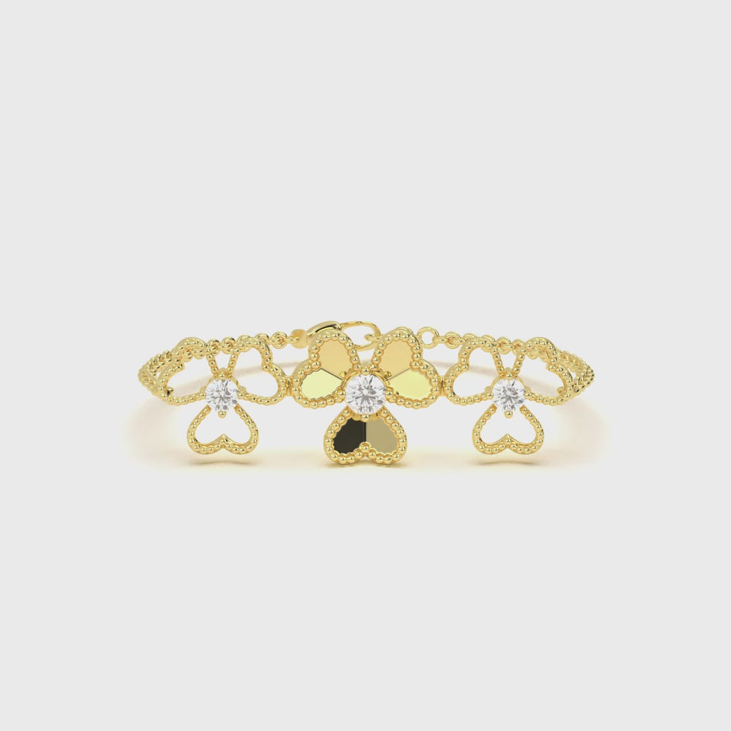 Gold chain bracelet with floral heart design